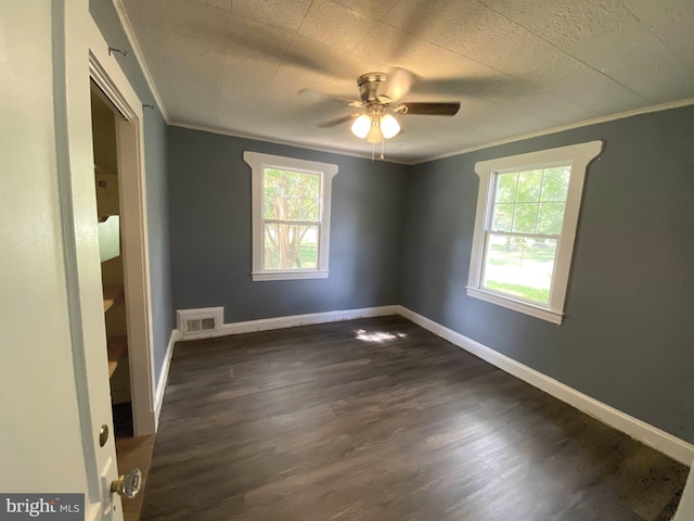 13304 Crain Hwy, Brandywine, MD 20613 - unfurnished room with plenty of natural light, ornamental molding, a ceiling fan, and dark wood-style floors