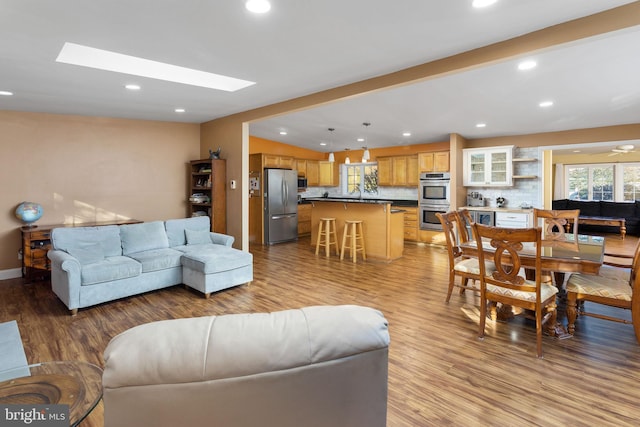 1733 Lockhart St, Toms River, NJ 08757 - living room with light wood-type flooring, recessed lighting, baseboards, and lofted ceiling