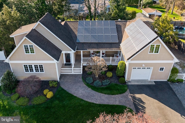1733 Lockhart St, Toms River, NJ 08757 - view of front facade with driveway, roof mounted solar panels, roof with shingles, and a garage