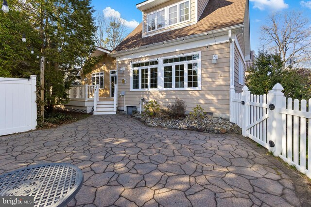 1733 Lockhart St, Toms River, NJ 08757 - view of front facade featuring a gate, a wooden deck, fence, and a shingled roof