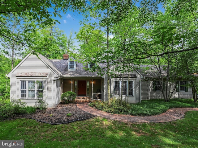 320 N Ridge Rd, Reinholds, PA 17569 - view of front of home featuring a porch, a chimney, and a front lawn