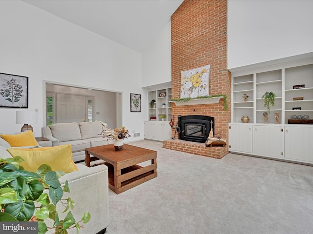 320 N Ridge Rd, Reinholds, PA 17569 - carpeted living area featuring high vaulted ceiling, built in features, and a wood stove