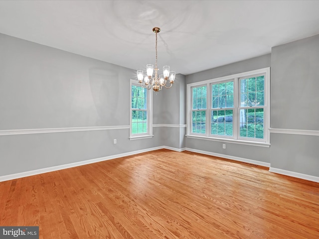 320 N Ridge Rd, Reinholds, PA 17569 - empty room with a chandelier, wood finished floors, and baseboards