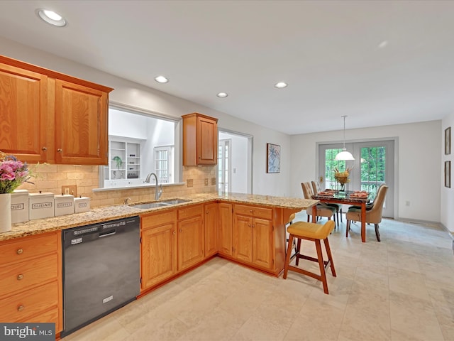 320 N Ridge Rd, Reinholds, PA 17569 - kitchen with black dishwasher, a sink, decorative backsplash, light stone countertops, and recessed lighting