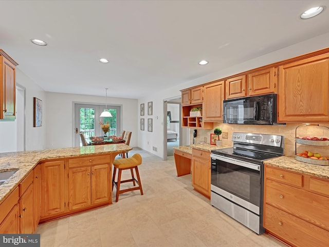 320 N Ridge Rd, Reinholds, PA 17569 - kitchen featuring black microwave, stainless steel electric range oven, backsplash, recessed lighting, and light stone countertops