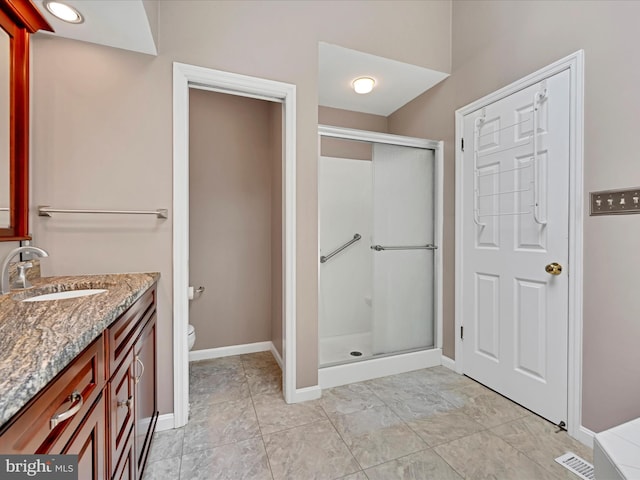 320 N Ridge Rd, Reinholds, PA 17569 - full bathroom with a stall shower, toilet, vanity, and baseboards