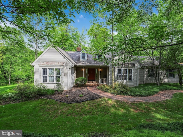 320 N Ridge Rd, Reinholds, PA 17569 - view of front of property featuring a porch, a front lawn, and a chimney