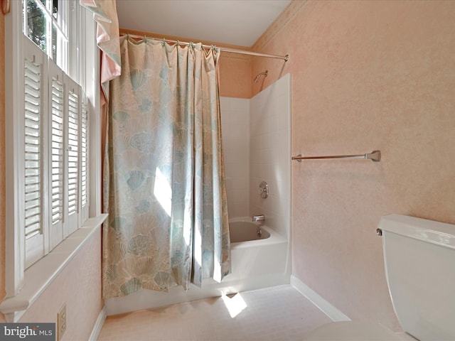 320 N Ridge Rd, Reinholds, PA 17569 - bathroom featuring shower / bath combination with curtain, toilet, and baseboards