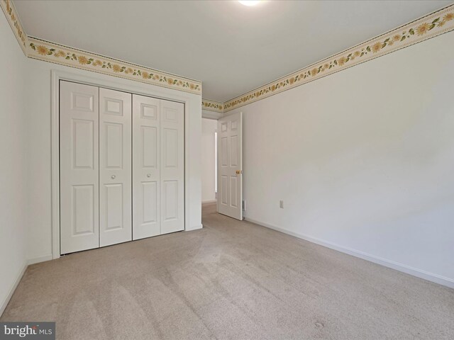 320 N Ridge Rd, Reinholds, PA 17569 - unfurnished bedroom featuring carpet flooring, a closet, and baseboards