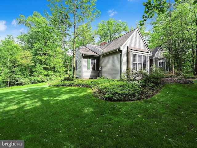 320 N Ridge Rd, Reinholds, PA 17569 - view of side of home featuring a yard and a shingled roof