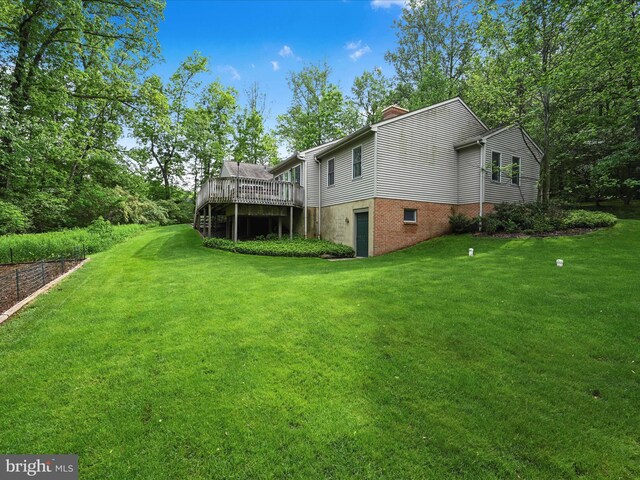 320 N Ridge Rd, Reinholds, PA 17569 - rear view of house featuring a deck, a chimney, and a yard