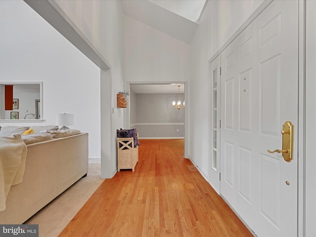 320 N Ridge Rd, Reinholds, PA 17569 - entryway with high vaulted ceiling, a chandelier, light wood finished floors, and baseboards