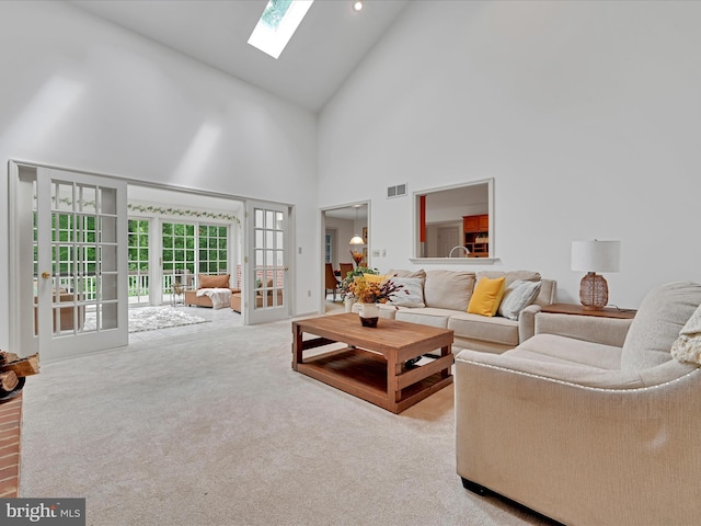 320 N Ridge Rd, Reinholds, PA 17569 - carpeted living room with a skylight, high vaulted ceiling, and french doors