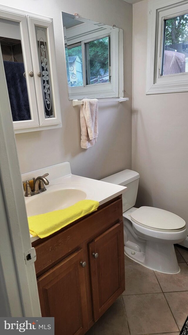15030 Alabama Ave, Woodbridge, VA 22191 - bathroom with tile patterned floors, toilet, and vanity