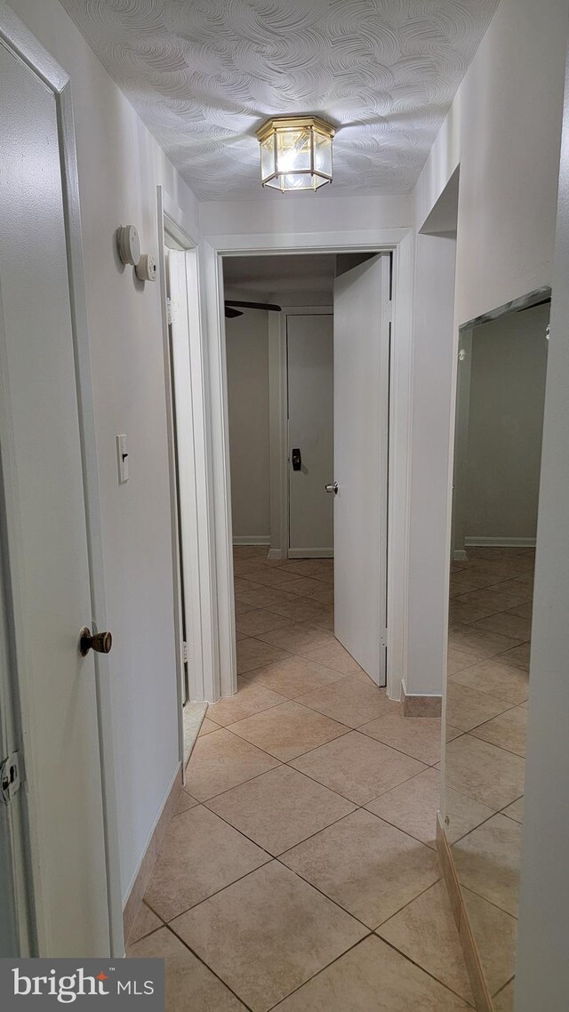15030 Alabama Ave, Woodbridge, VA 22191 - hallway featuring light tile patterned floors