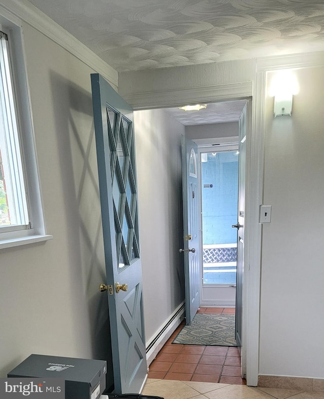 15030 Alabama Ave, Woodbridge, VA 22191 - hall with baseboard heating, tile patterned flooring, and baseboards
