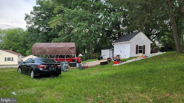 15030 Alabama Ave, Woodbridge, VA 22191 - view of grassy yard featuring a storage unit and an outdoor structure