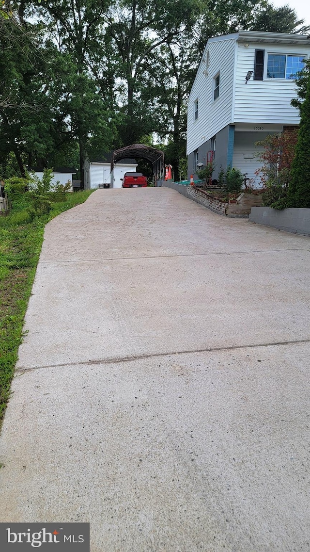 15030 Alabama Ave, Woodbridge, VA 22191 - view of side of property with driveway and a carport