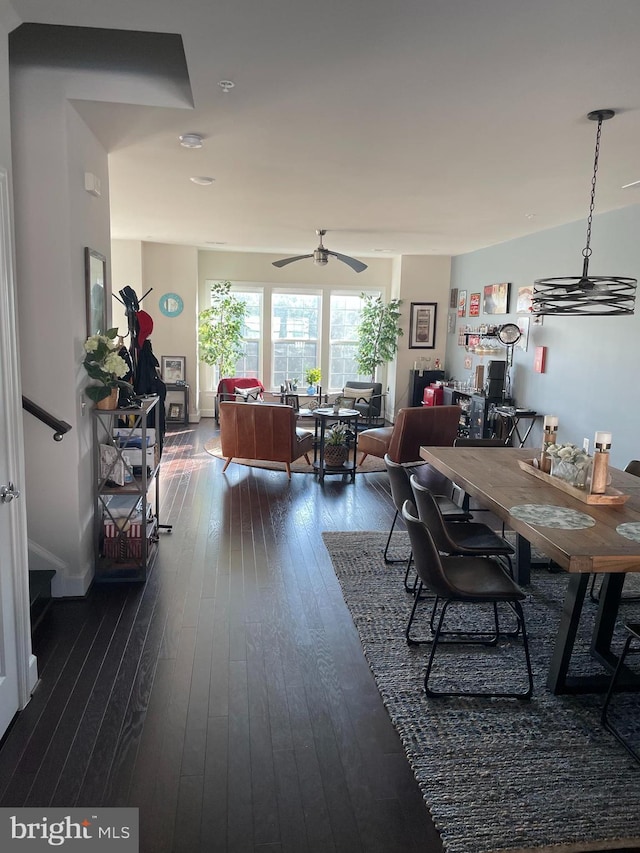 dining room featuring dark wood-style floors and ceiling fan
