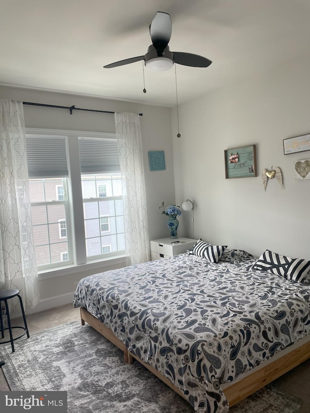 carpeted bedroom with ceiling fan