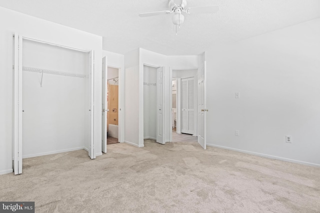 31 Beagle Run Unit 88, Nottingham, MD 21236 - unfurnished bedroom with carpet floors, multiple closets, baseboards, connected bathroom, and ceiling fan
