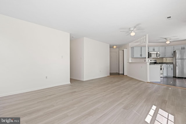 31 Beagle Run Unit 88, Nottingham, MD 21236 - unfurnished living room with ceiling fan, light wood-type flooring, and baseboards
