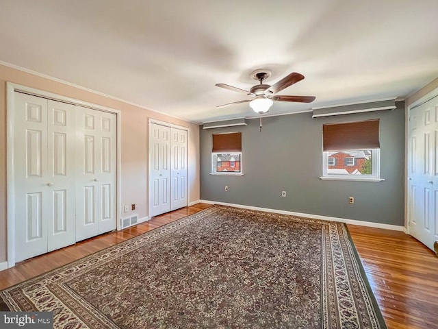 12419 Balston Rd, Philadelphia, PA 19154 - unfurnished bedroom with two closets, wood finished floors, baseboards, and ornamental molding