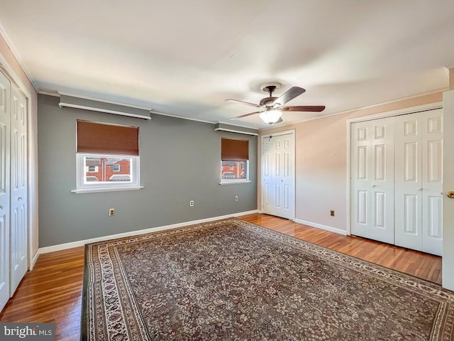 12419 Balston Rd, Philadelphia, PA 19154 - unfurnished bedroom featuring wood finished floors, two closets, baseboards, and ornamental molding