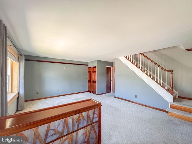 12419 Balston Rd, Philadelphia, PA 19154 - unfurnished living room with carpet flooring, baseboards, and stairs