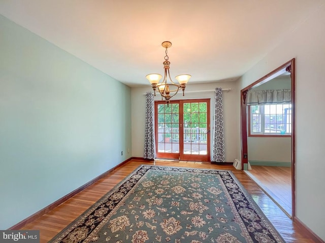 12419 Balston Rd, Philadelphia, PA 19154 - spare room with a chandelier, wood finished floors, and baseboards