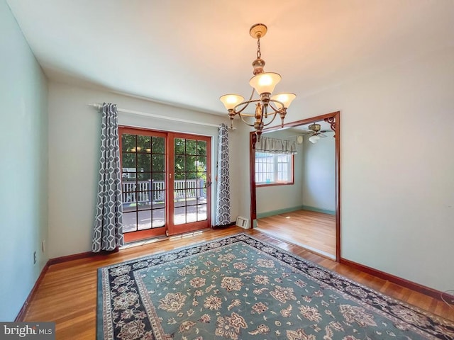 12419 Balston Rd, Philadelphia, PA 19154 - spare room with a chandelier, wood finished floors, baseboards, and a ceiling fan