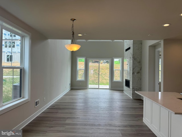 505 Trifecta Rd Unit 373, Downingtown, PA 19335 - unfurnished dining area featuring plenty of natural light, recessed lighting, a premium fireplace, and dark wood finished floors