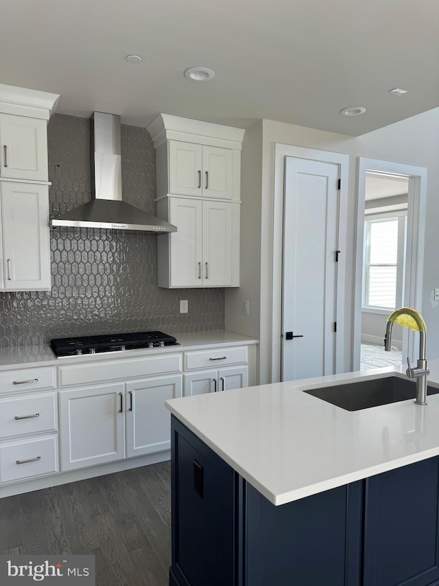 505 Trifecta Rd Unit 373, Downingtown, PA 19335 - kitchen with wall chimney range hood, a sink, light countertops, dark wood finished floors, and recessed lighting