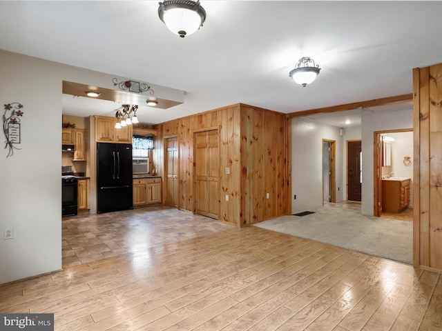 12417 Mount Savage Rd, Mount Savage, MD 21545 - unfurnished living room with light wood-type flooring, wooden walls, and cooling unit