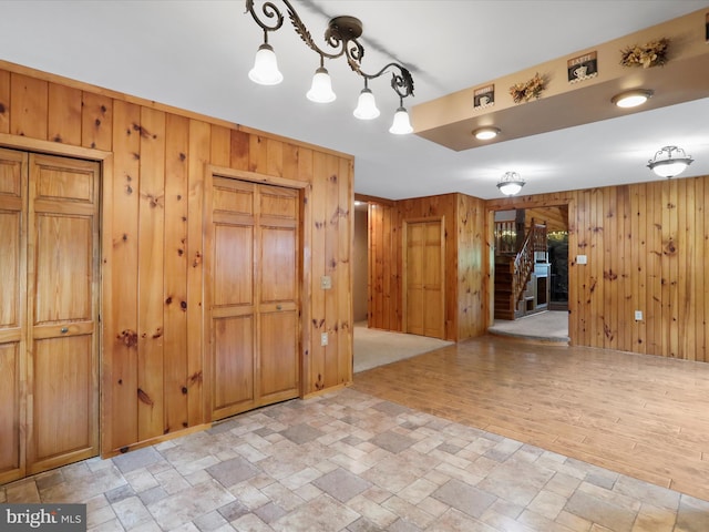 12417 Mount Savage Rd, Mount Savage, MD 21545 - interior space with wooden walls, stairway, and light stone finish flooring