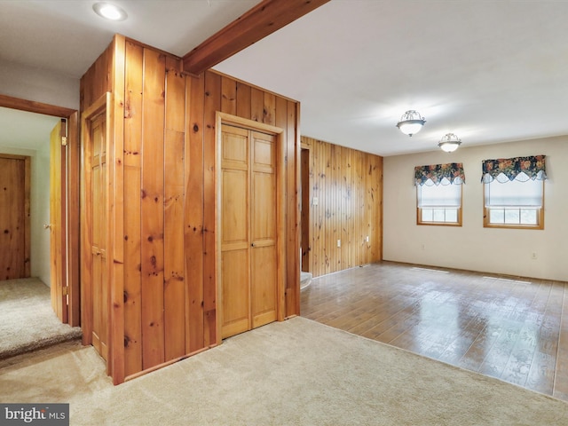 12417 Mount Savage Rd, Mount Savage, MD 21545 - unfurnished room featuring wooden walls, carpet flooring, beam ceiling, and wood finished floors
