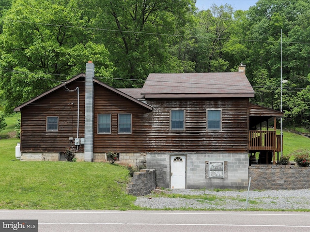 12417 Mount Savage Rd, Mount Savage, MD 21545 - view of front of property featuring a chimney, a front yard, and a forest view