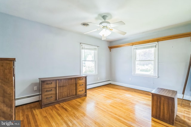 1143 Villanova Ave, Swarthmore, PA 19081 - unfurnished bedroom with a baseboard radiator, light wood finished floors, baseboards, and ceiling fan