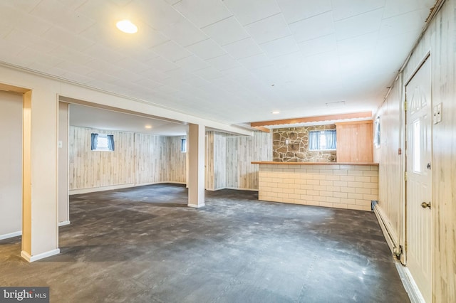 1143 Villanova Ave, Swarthmore, PA 19081 - below grade area featuring a baseboard radiator, wood walls, and baseboards