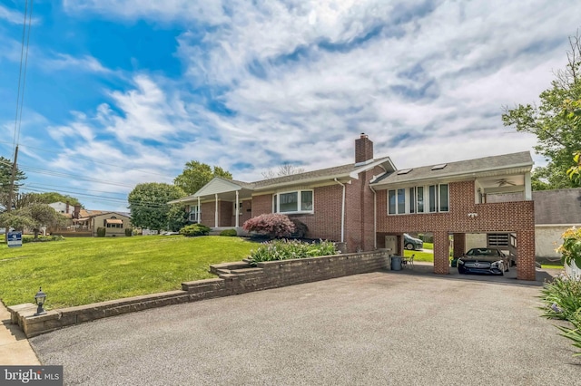 1143 Villanova Ave, Swarthmore, PA 19081 - single story home featuring brick siding, driveway, a chimney, a front lawn, and ceiling fan