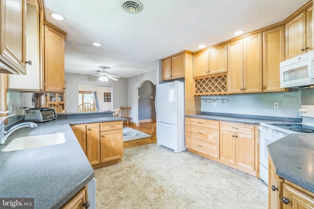 1143 Villanova Ave, Swarthmore, PA 19081 - kitchen featuring white appliances, arched walkways, a sink, a ceiling fan, and recessed lighting