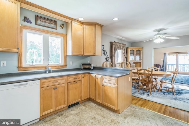 1143 Villanova Ave, Swarthmore, PA 19081 - kitchen featuring dishwasher, a sink, a peninsula, a ceiling fan, and dark countertops
