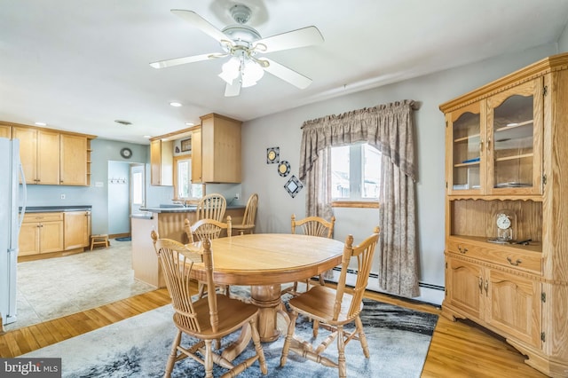 1143 Villanova Ave, Swarthmore, PA 19081 - dining space with healthy amount of natural light, light wood-style floors, a ceiling fan, a baseboard heating unit, and recessed lighting