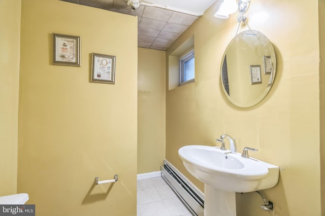1143 Villanova Ave, Swarthmore, PA 19081 - bathroom featuring a baseboard heating unit, tile patterned floors, and baseboards