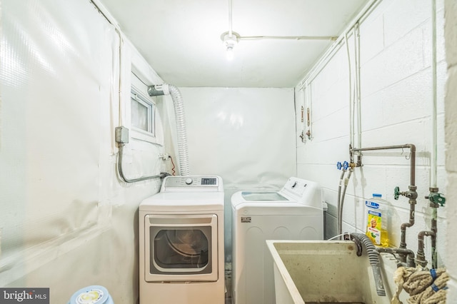 1143 Villanova Ave, Swarthmore, PA 19081 - washroom with washing machine and dryer and concrete block wall