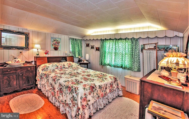 136 Camp Meeting Cir, Herndon, PA 17830 - bedroom with hardwood / wood-style floors, vaulted ceiling, and wooden walls