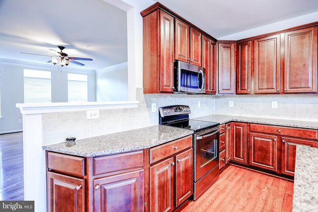 6300 Santo Pl, Capitol Heights, MD 20743 - kitchen with appliances with stainless steel finishes, ceiling fan, light wood-type flooring, light stone countertops, and crown molding