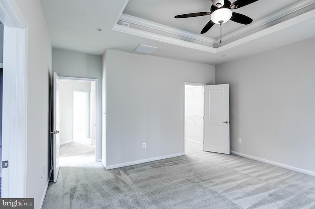 6300 Santo Pl, Capitol Heights, MD 20743 - spare room with a tray ceiling, crown molding, carpet flooring, ceiling fan, and baseboards