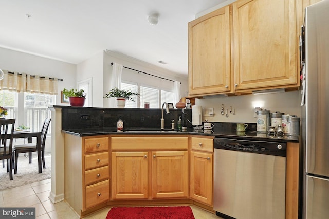 1009 Samantha Ln Unit 302, Odenton, MD 21113 - kitchen featuring appliances with stainless steel finishes, a sink, light tile patterned floors, and a peninsula