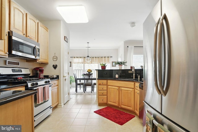 1009 Samantha Ln Unit 302, Odenton, MD 21113 - kitchen featuring stainless steel appliances, a sink, dark countertops, and light tile patterned floors